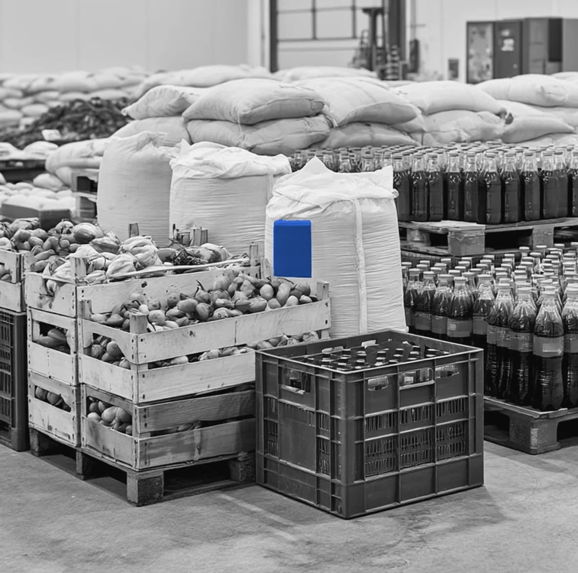 Sacks, crates and bottled stock in a food warehouse